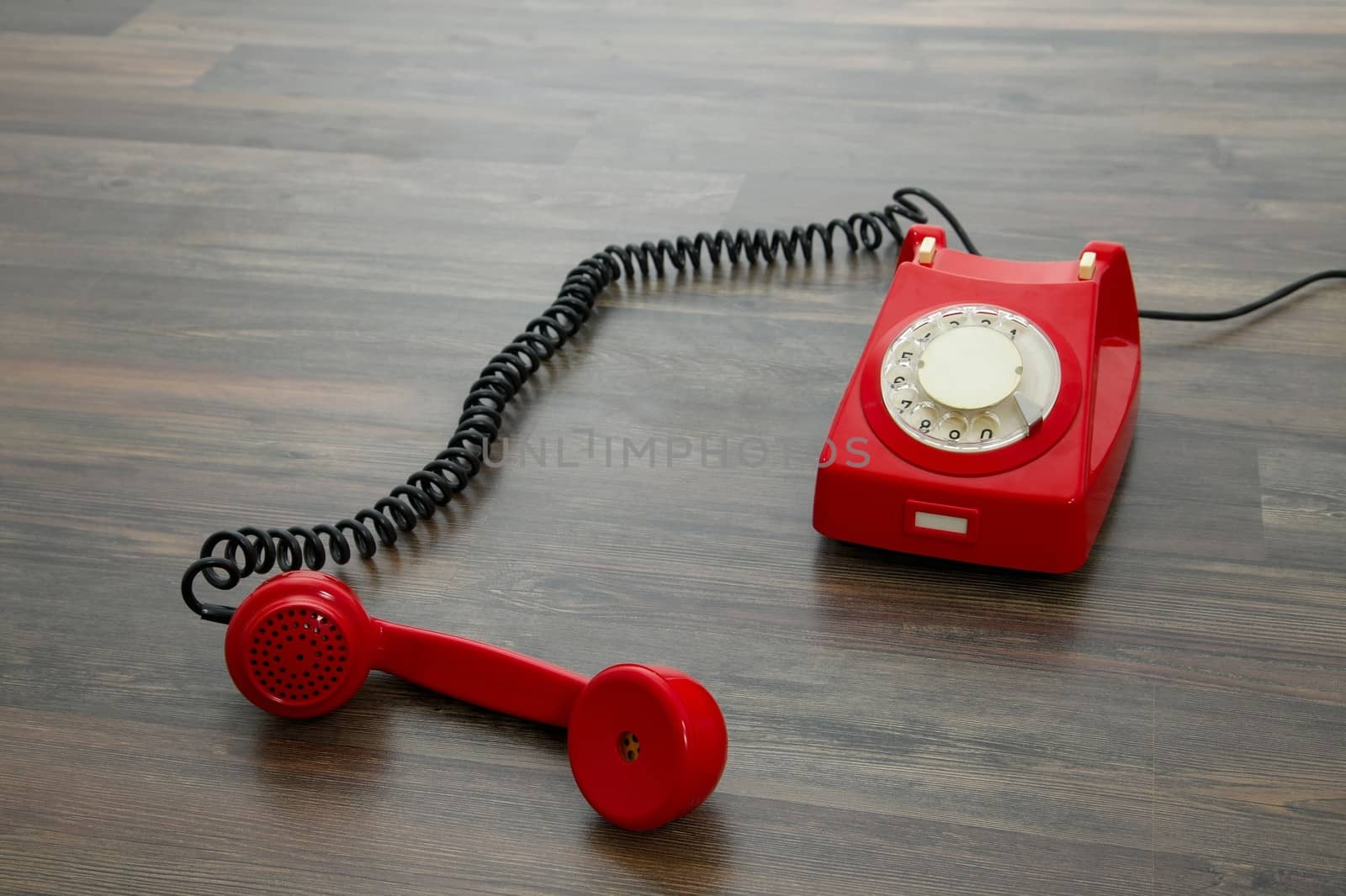 Red vintage phone on the floor