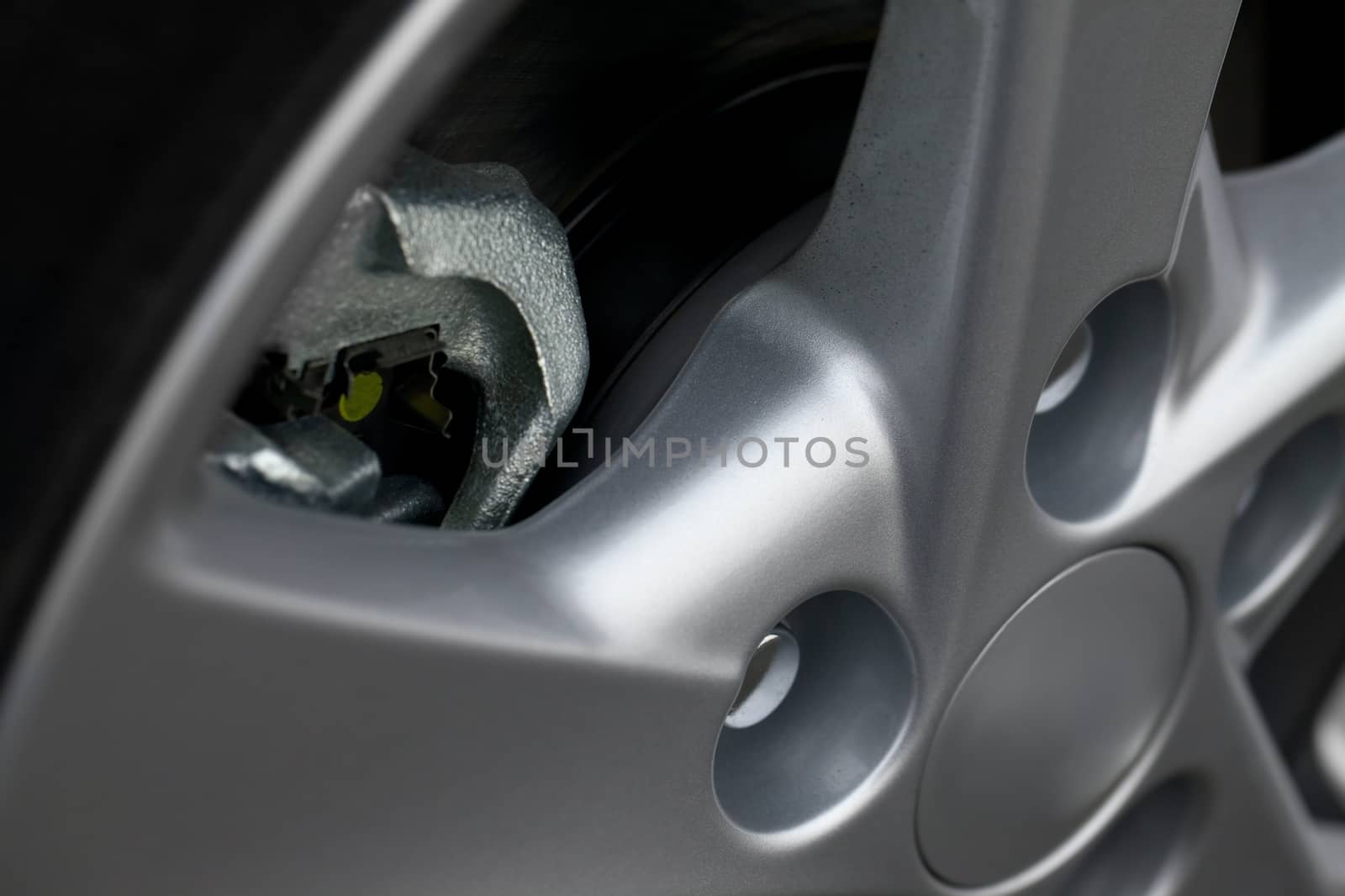 Wheel closeup with brake disc and caliper