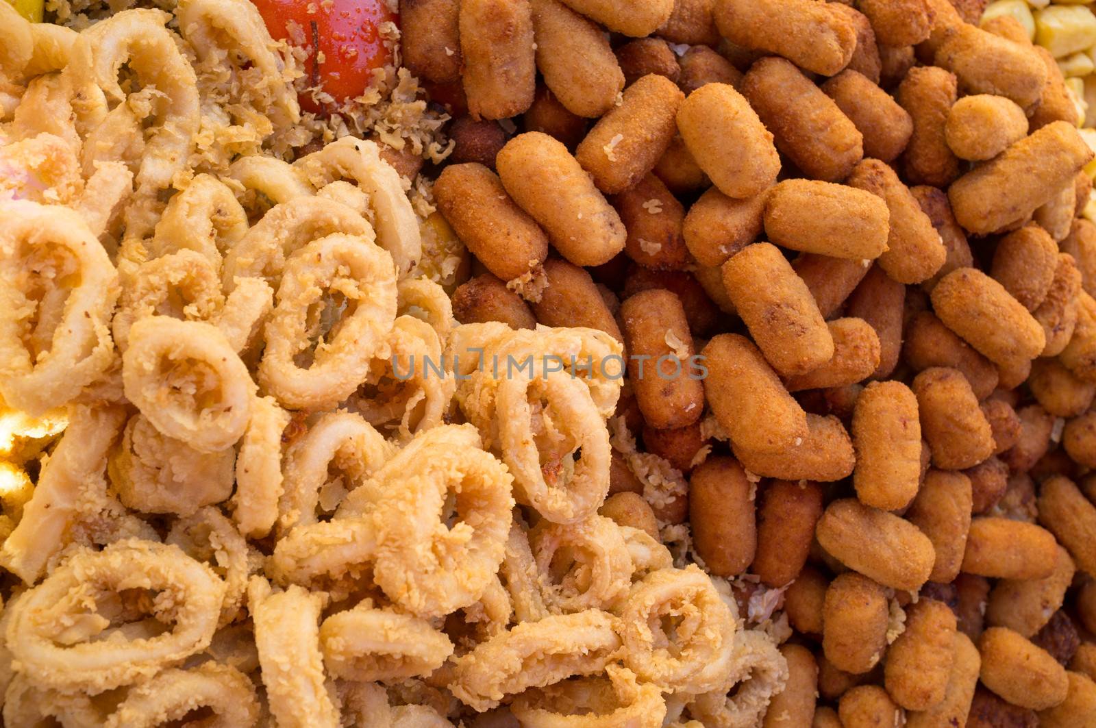 Squid rings and seafood croquetets, traditional Spanish tapas