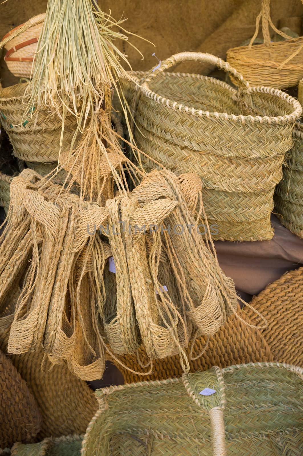 Assorted items of wickerwork on a market stall