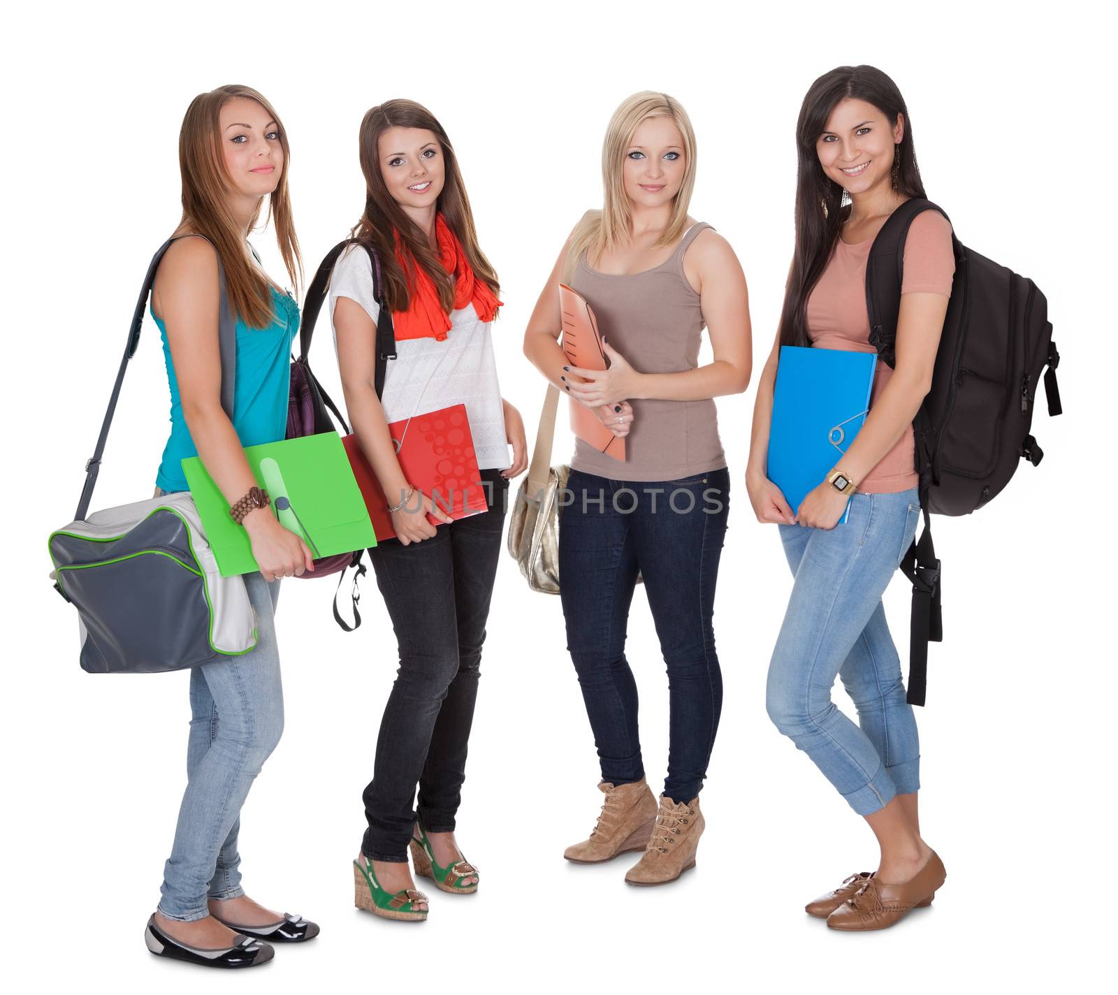 Studio shot of four female students isolated on white