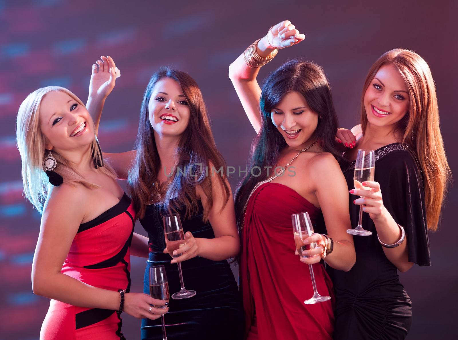 Stylish women toasting with champagne by AndreyPopov