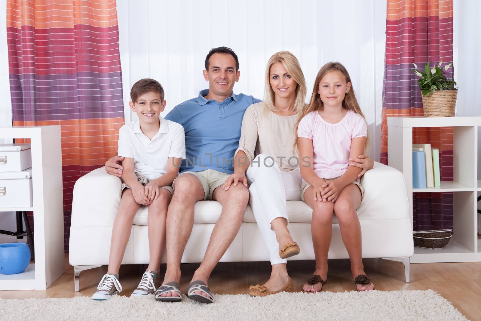 A Happy Family With Two Children by AndreyPopov