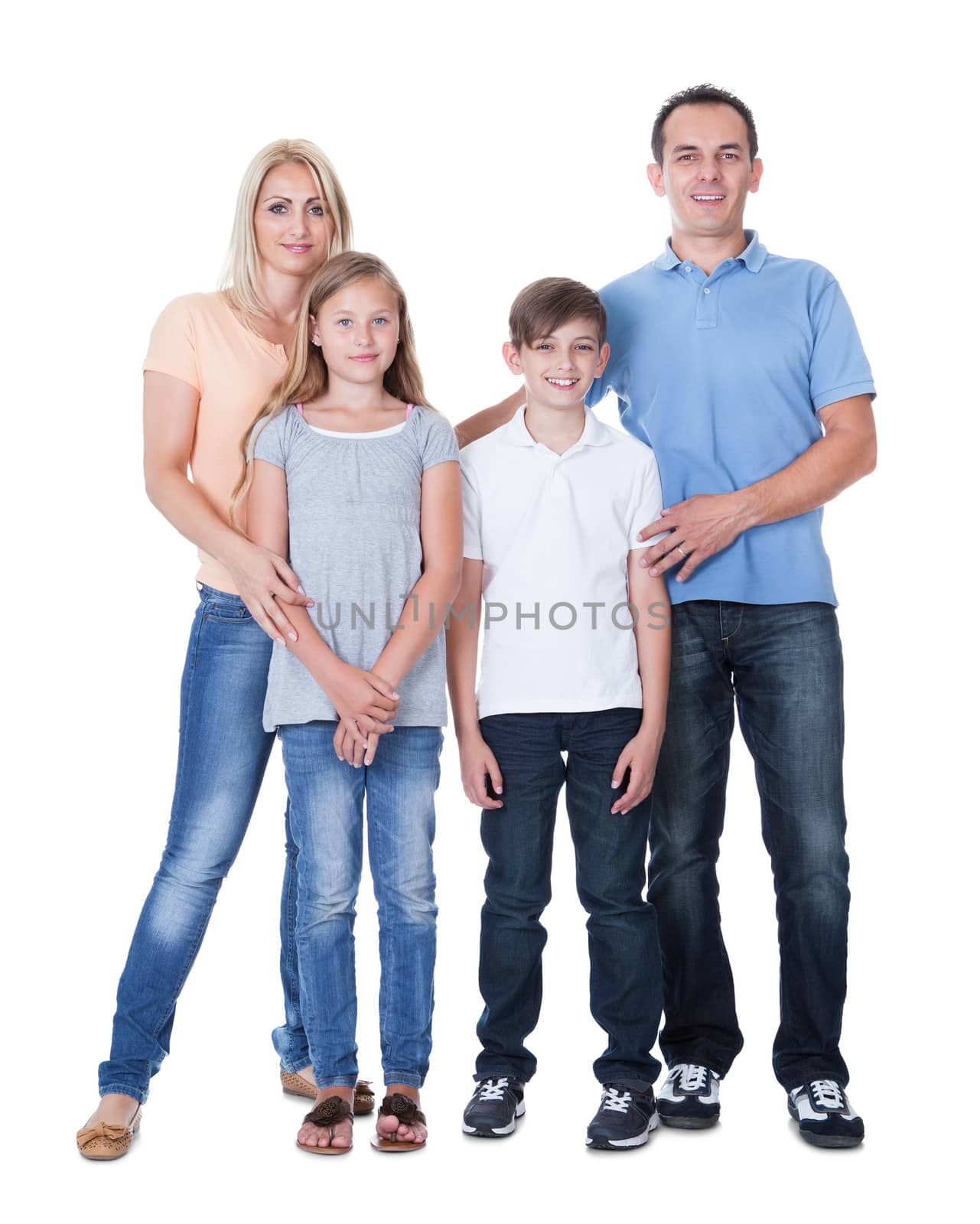 Portrait Of Happy Family With Two Children Isolated On White Background