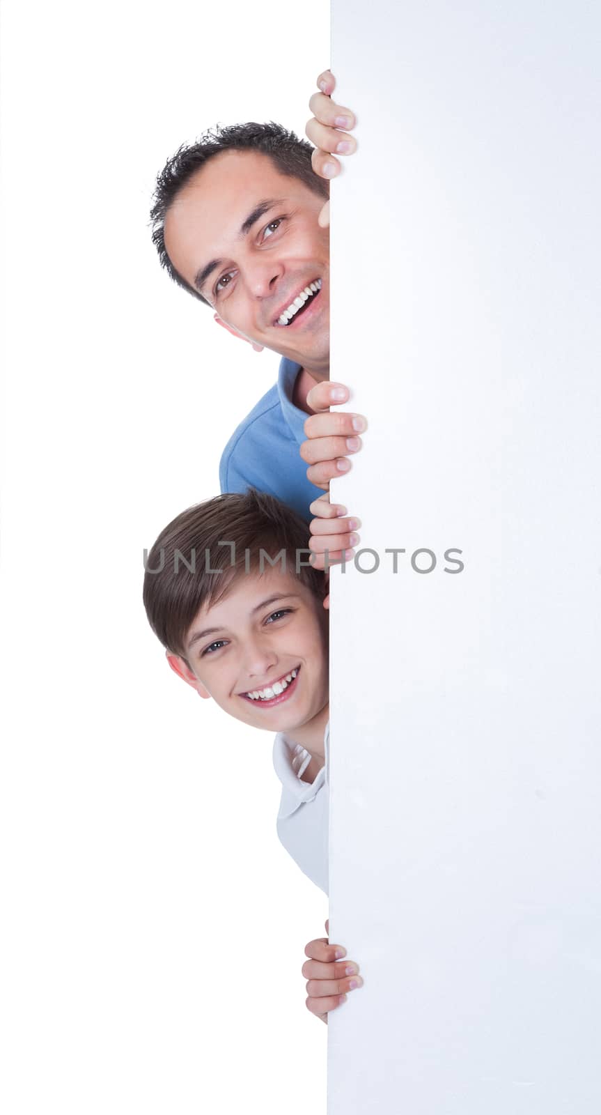 Portrait Of Father and Boy Behind Blank Board by AndreyPopov