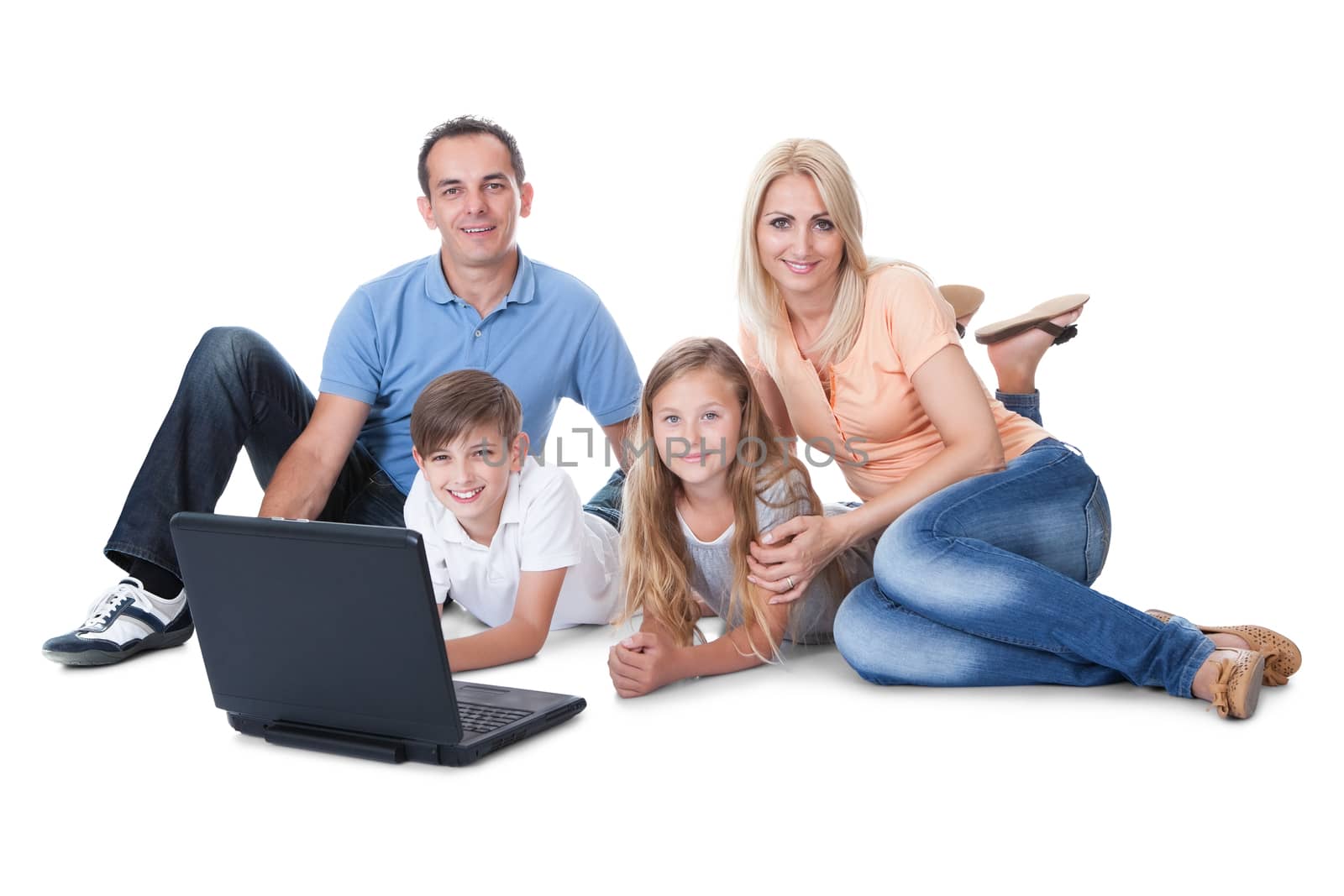 A Happy Family With Two Children Using Laptop Isolated On White Background
