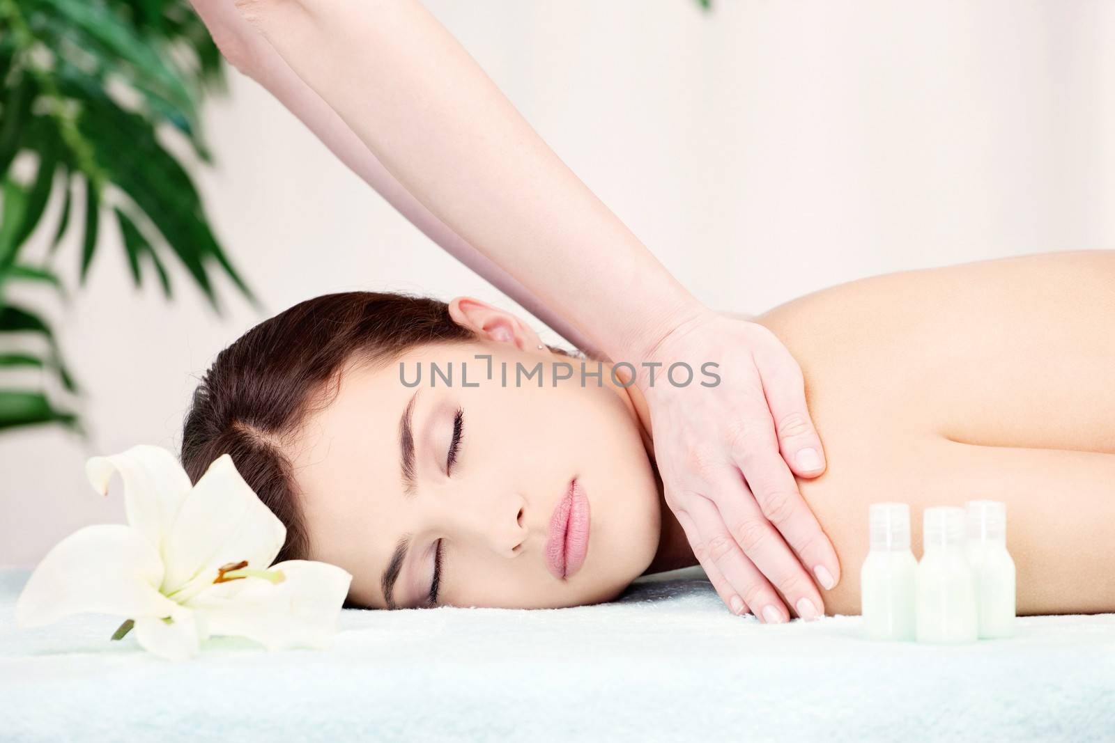 Shoulder massage in spa center