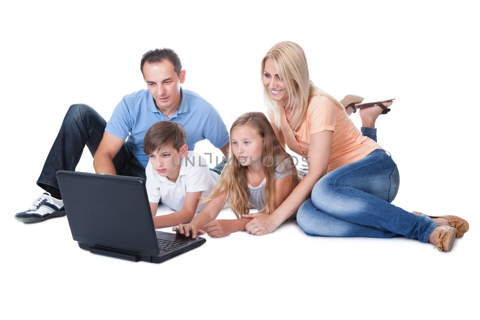 A Happy Family With Two Children Using Laptop Isolated On White Background