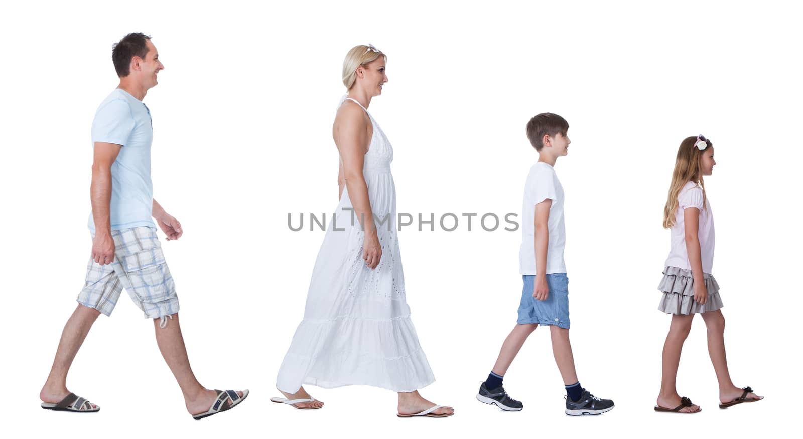 A Happy Family With Two Children Walking In A Line Isolated On White Background