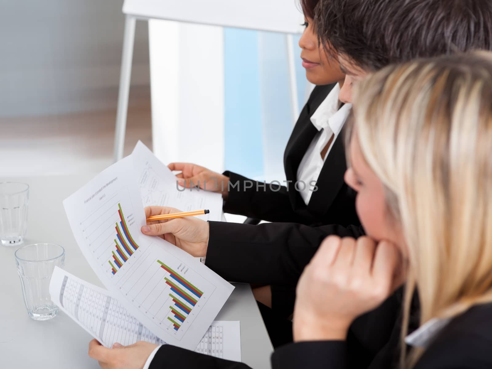 Group of business people at presentation applauding to the lecturer