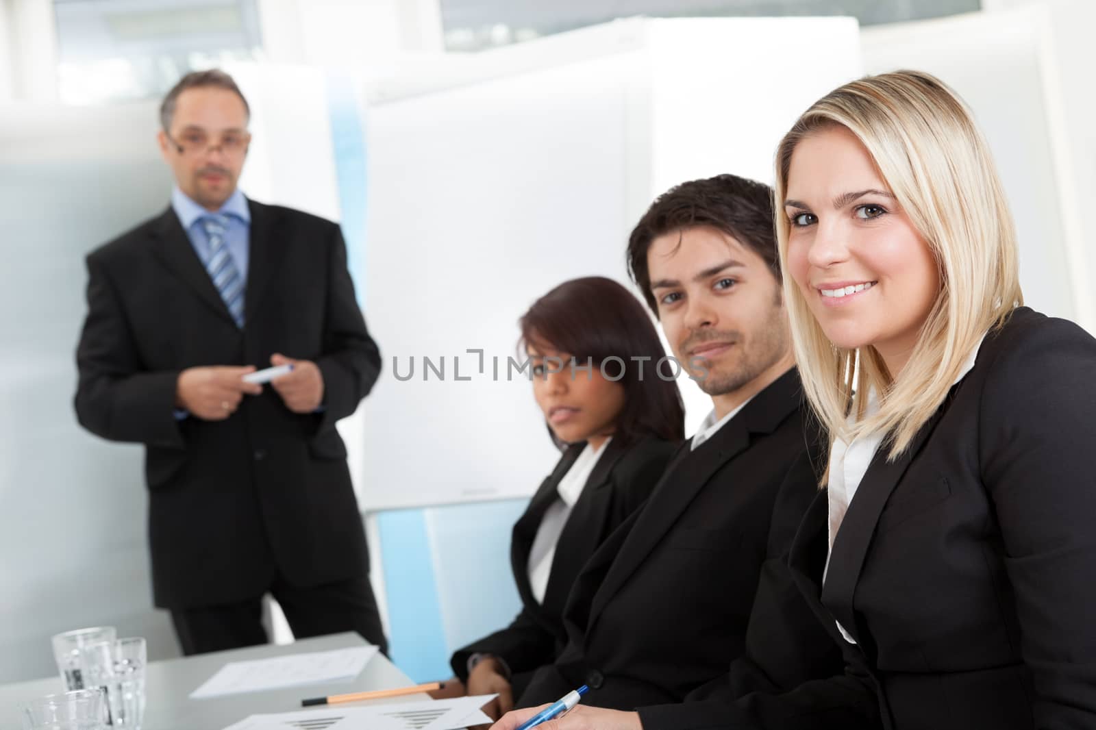 Group of business people at presentation by AndreyPopov