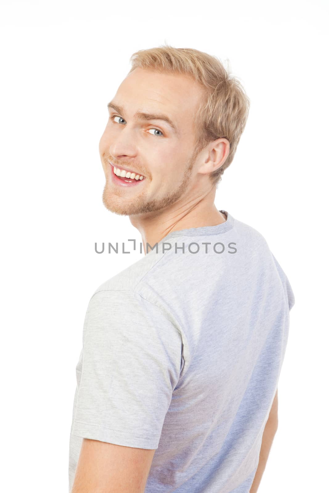portrait of a young man smiling by courtyardpix