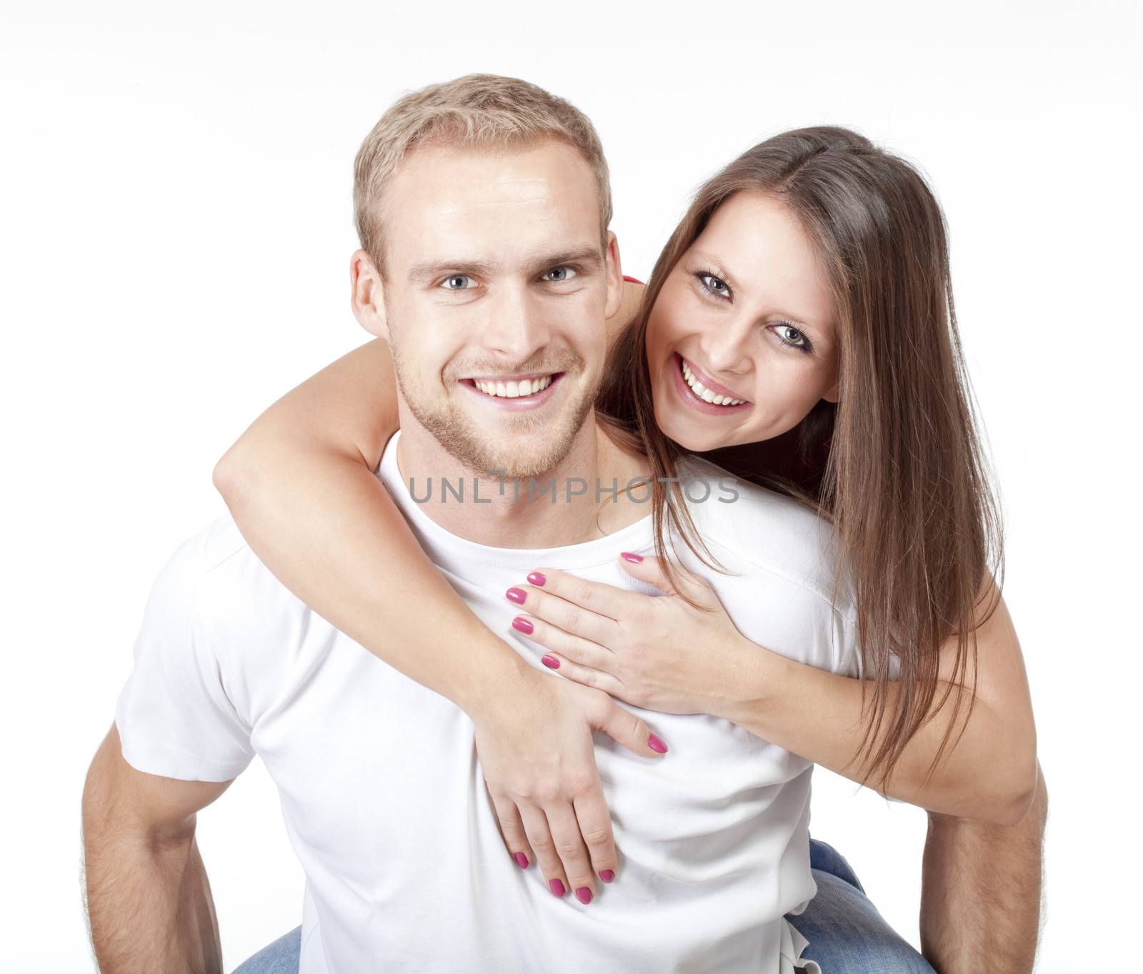 portrait of a happy young couple smiling, looking - isolated on white