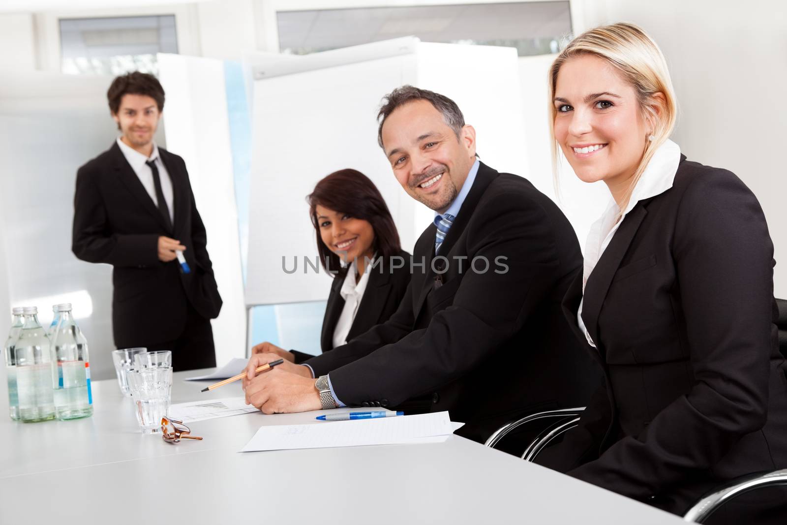 Group of business people at presentation by AndreyPopov