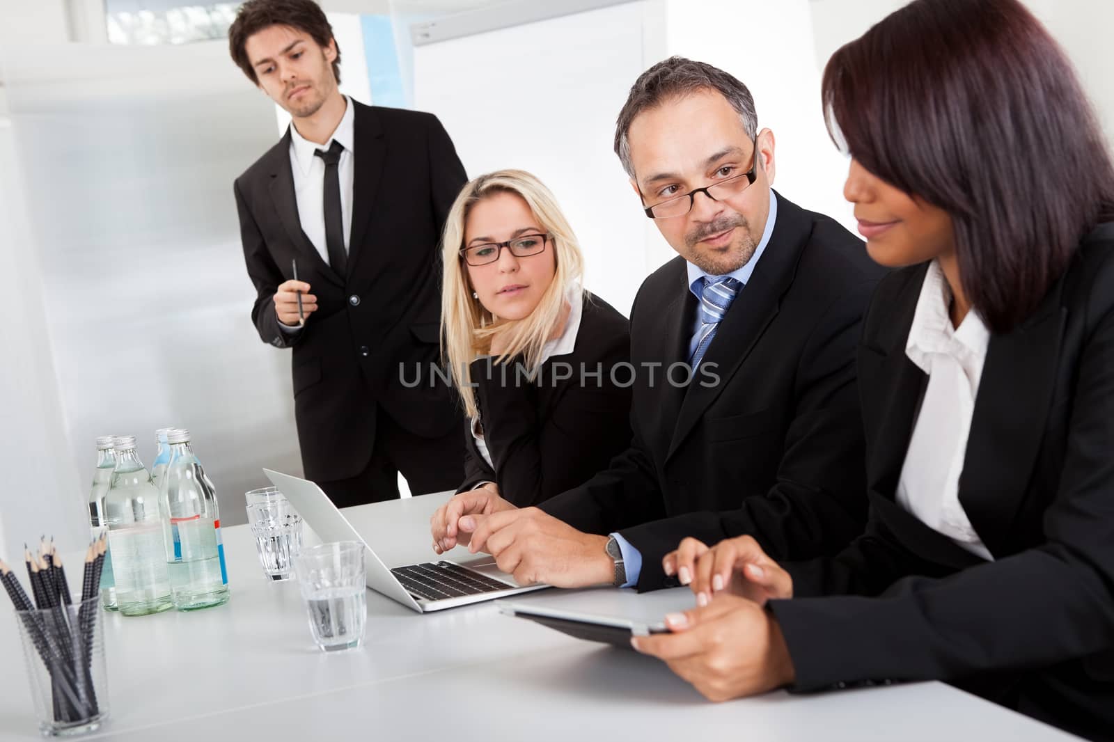 Group of business people at presentation by AndreyPopov