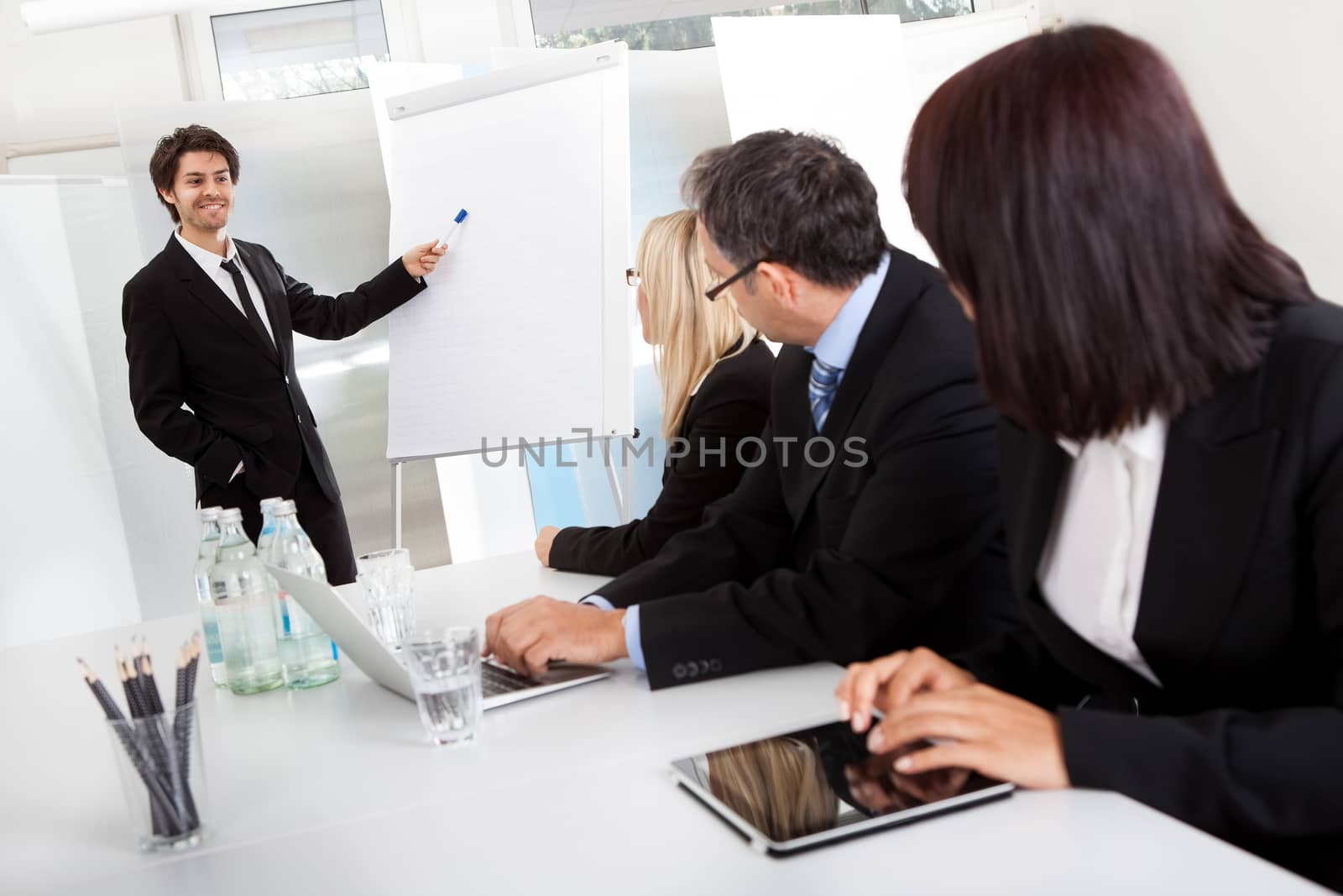 Group of business people at presentation by AndreyPopov