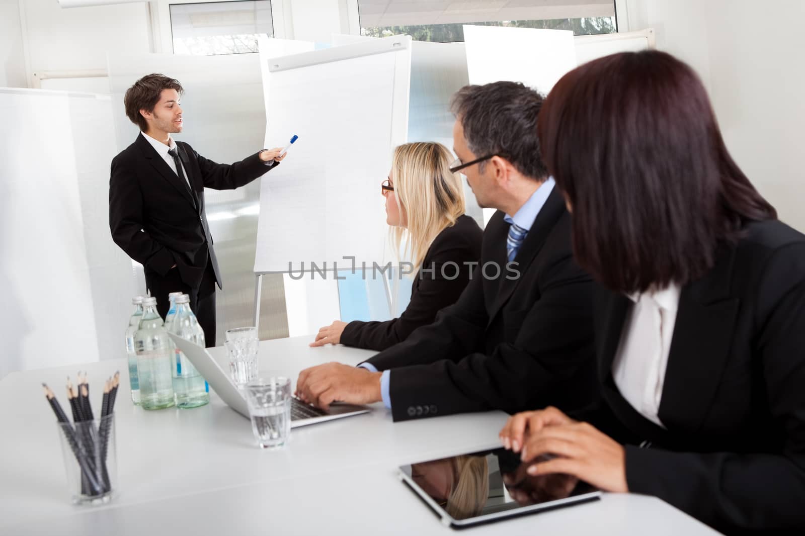 Group of business people at presentation by AndreyPopov