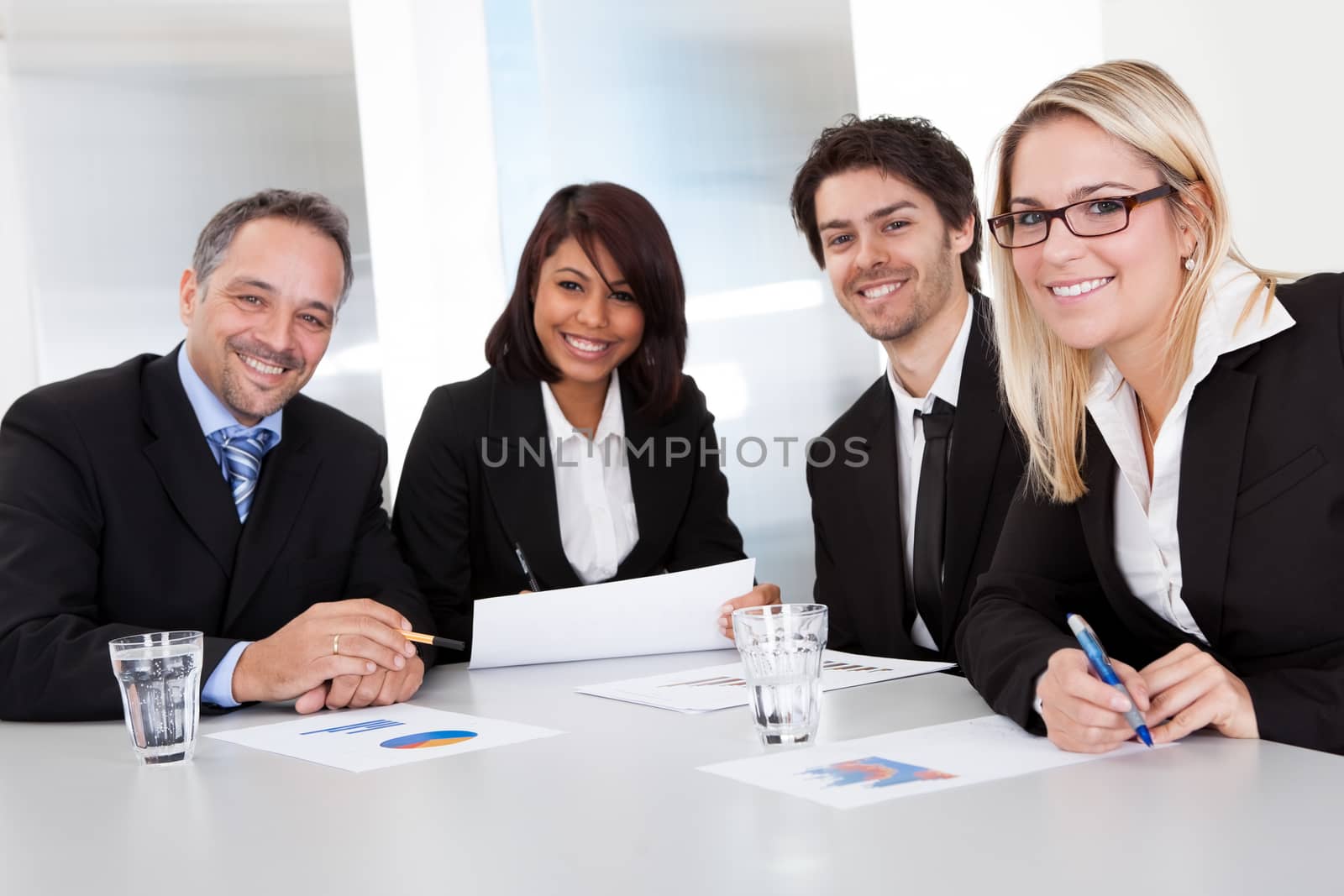 Group of business people at the meeting discussing