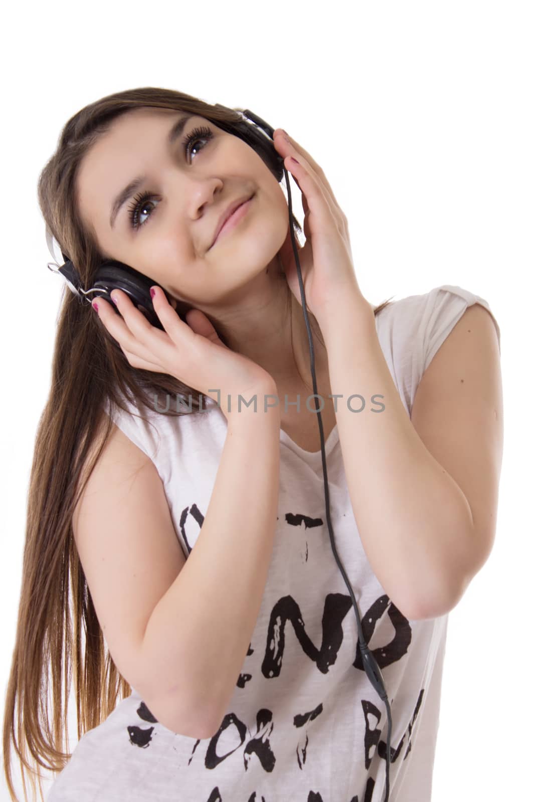 Joyful teen girl with headphones listens to the music by Angel_a