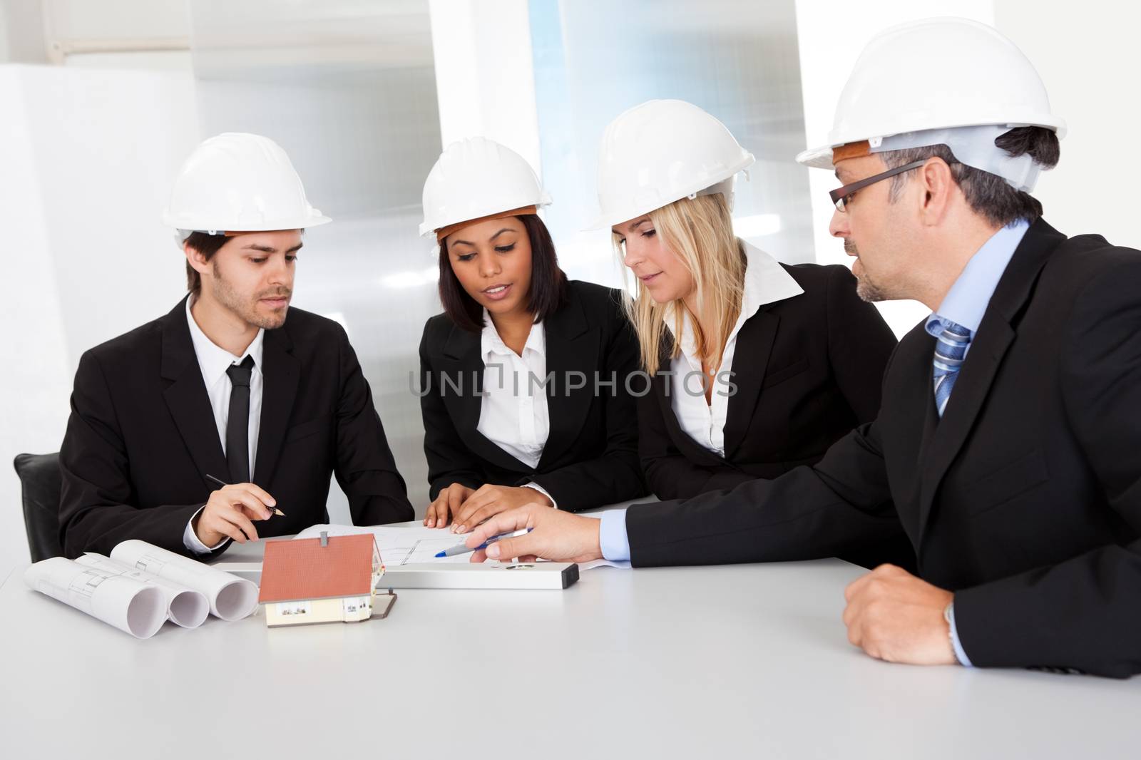 Group of architects at the meeting discussing the project