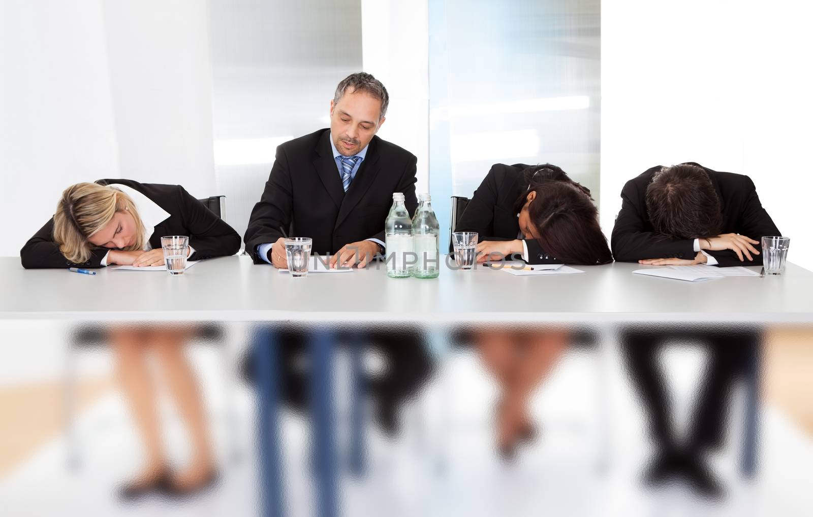 Group of business people sleeping at the meeting