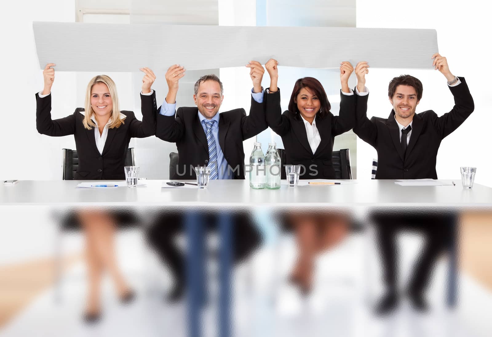 Group of business people holding empty placard