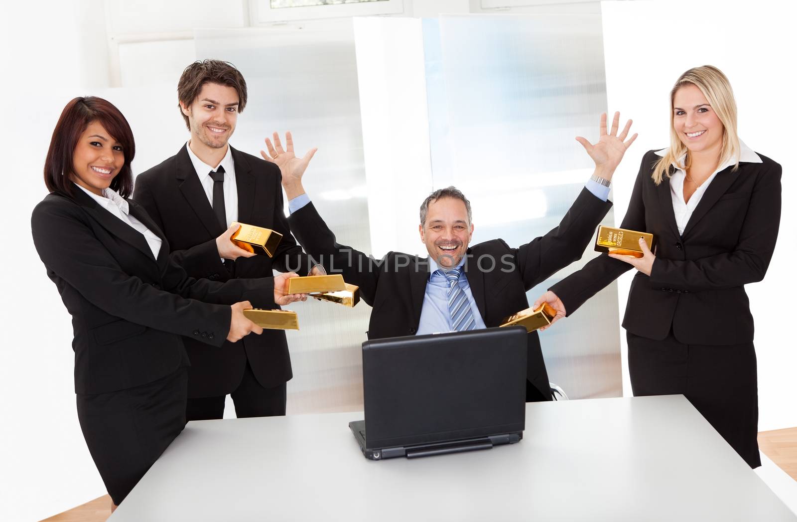 Portrait of happy businessman receiving gold bars