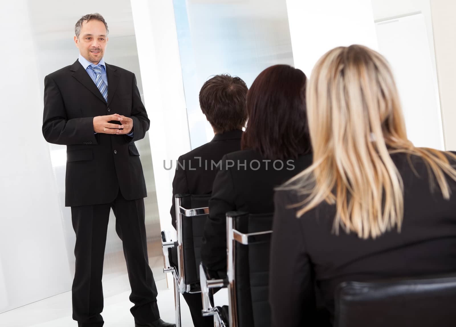 Group of successful business people at the lecture