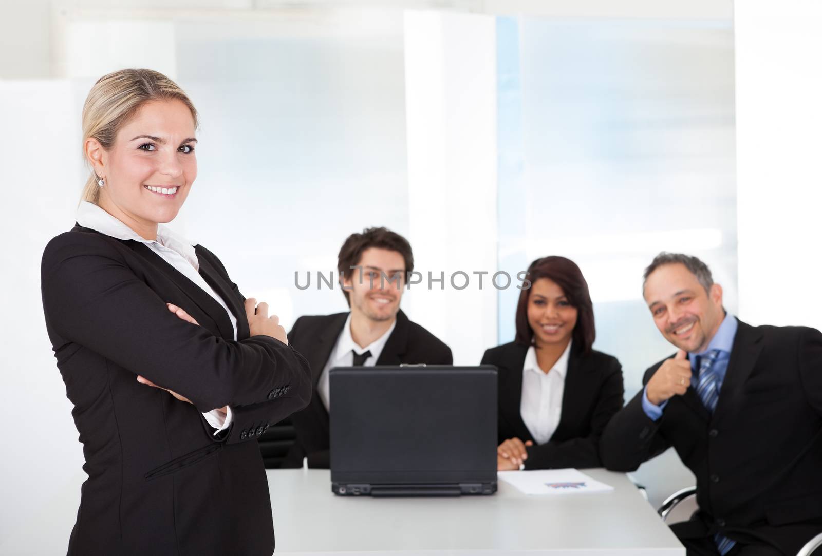 Portrait successful business woman and her team