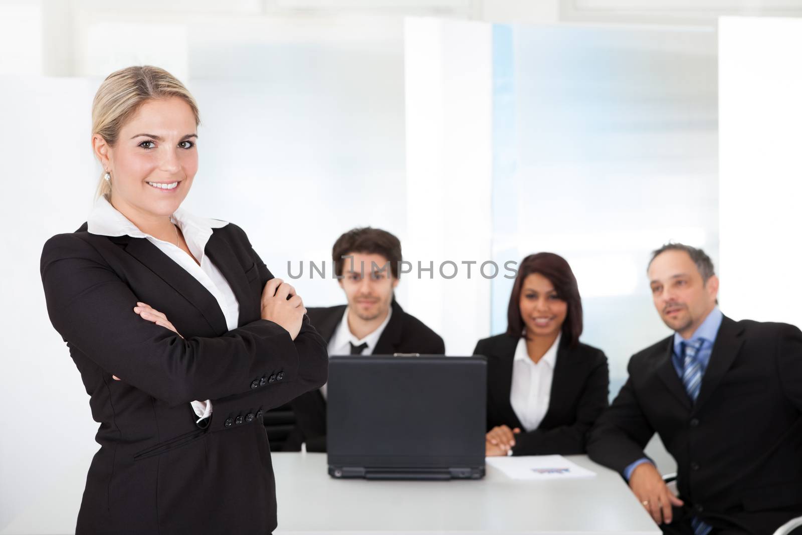 Portrait successful business woman and her team