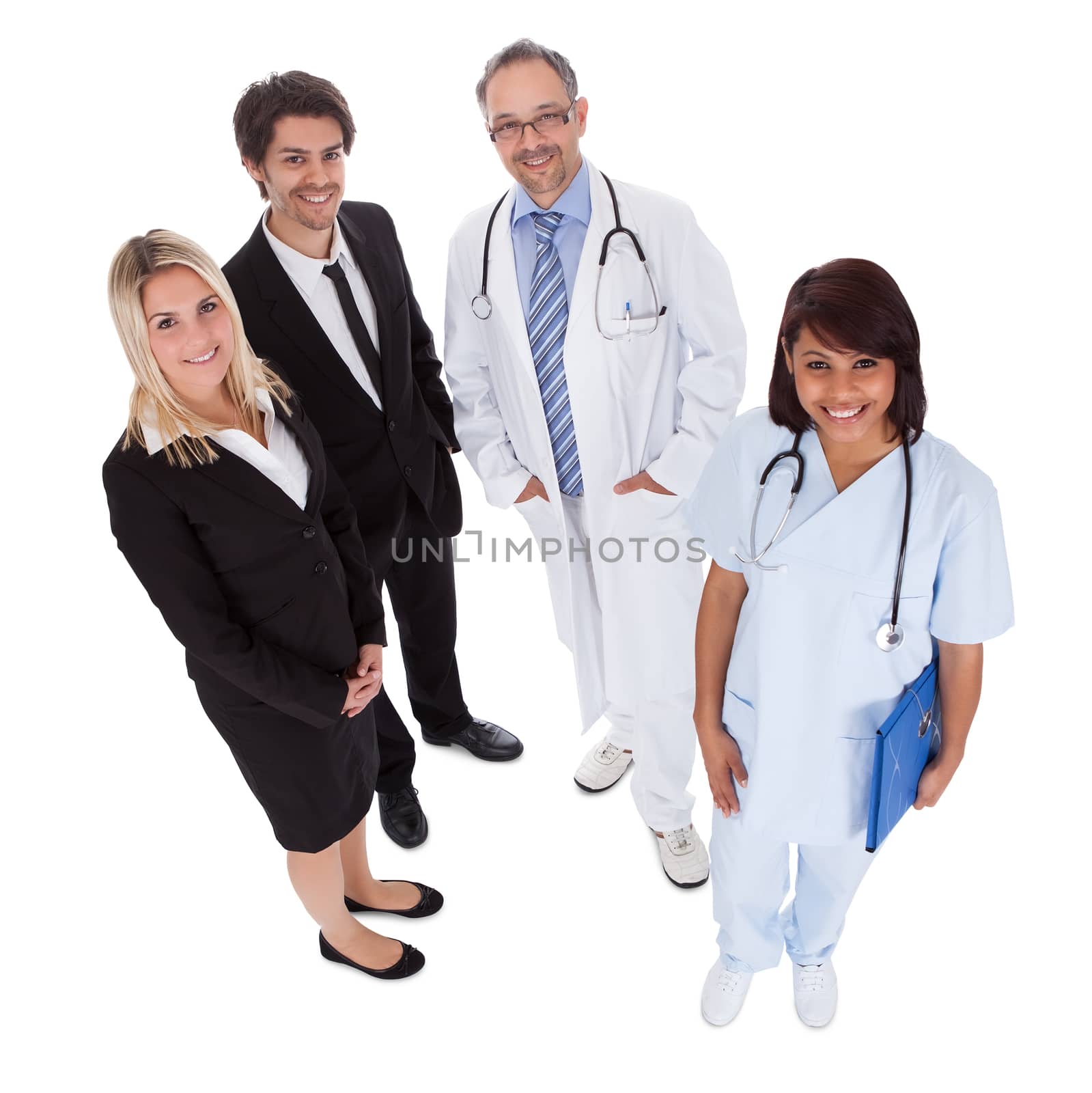 Portrait of businesspeople and medical workers standing on white background