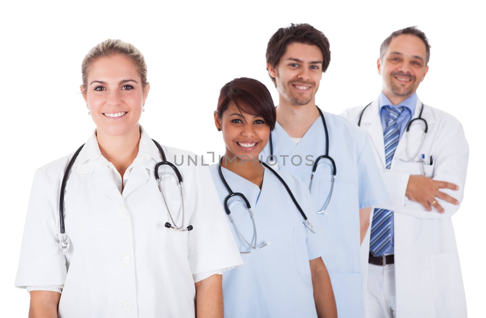 Group of doctors standing together isolated over white background