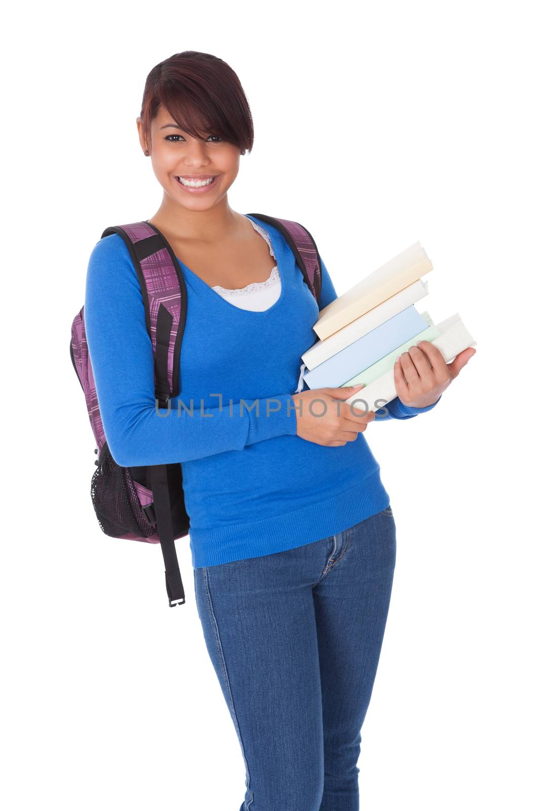 Portrait of beautiful student girl with books. Isolated on white