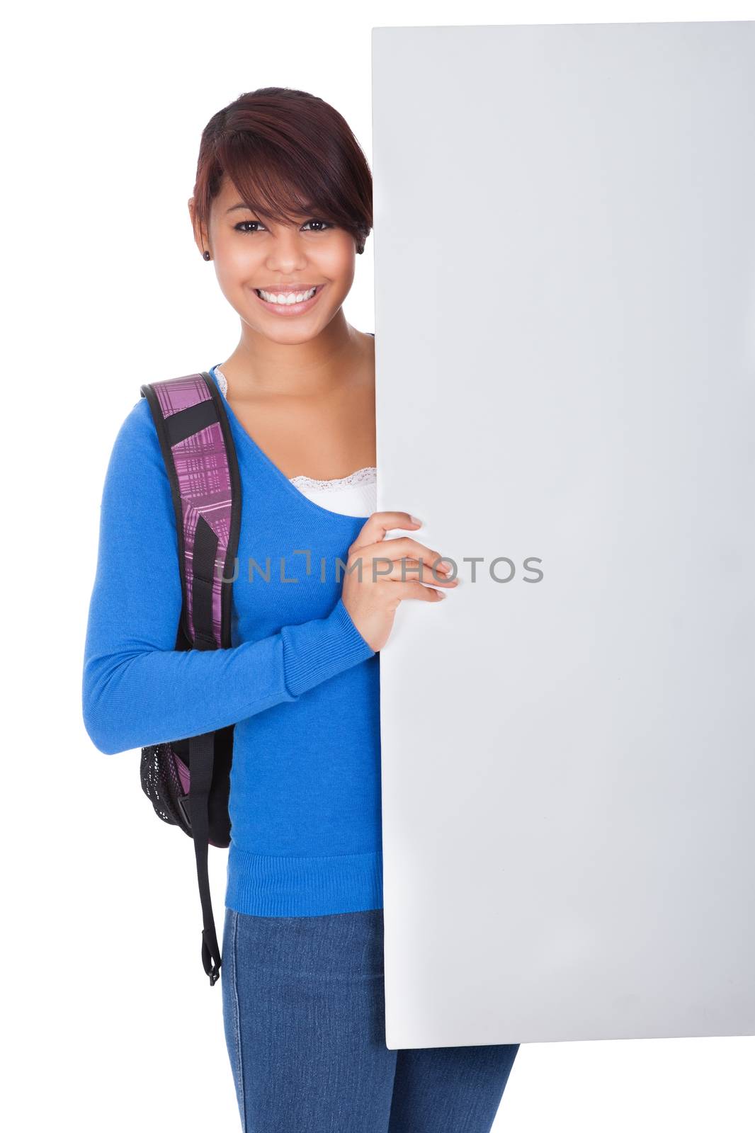 Beautiful student girl presenting empty banner. Isolated on white