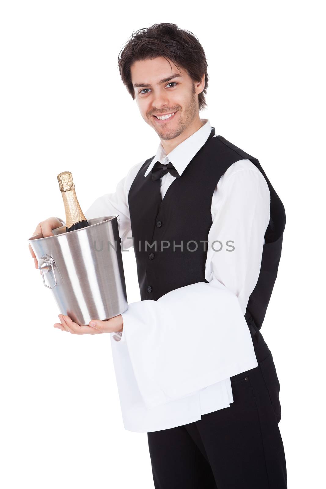 Portrait of a butler with bottle of champagne in a bucket. Isolated on white