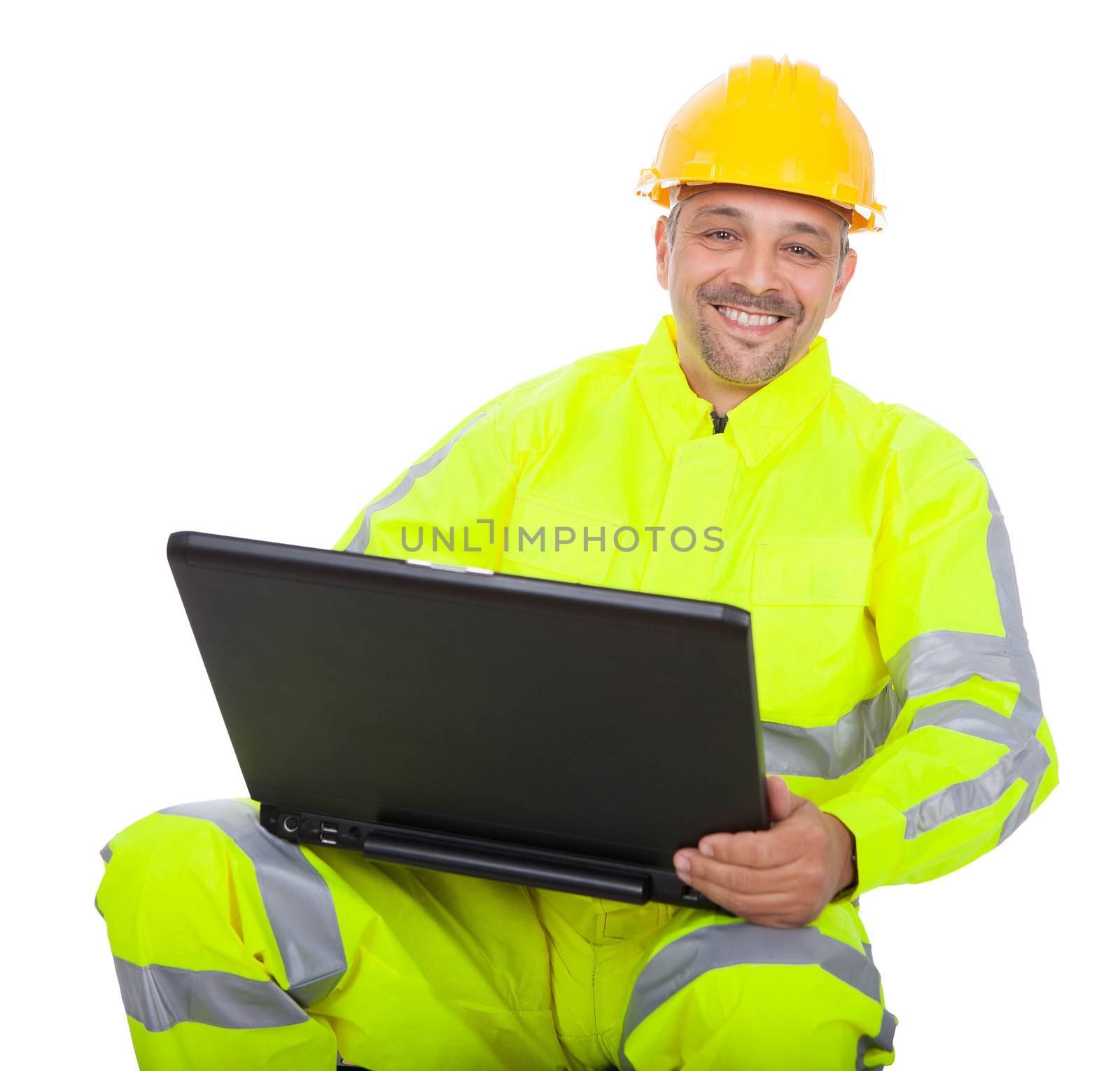 Portrait of worker in safety jacket working on laptop. Isolated on white