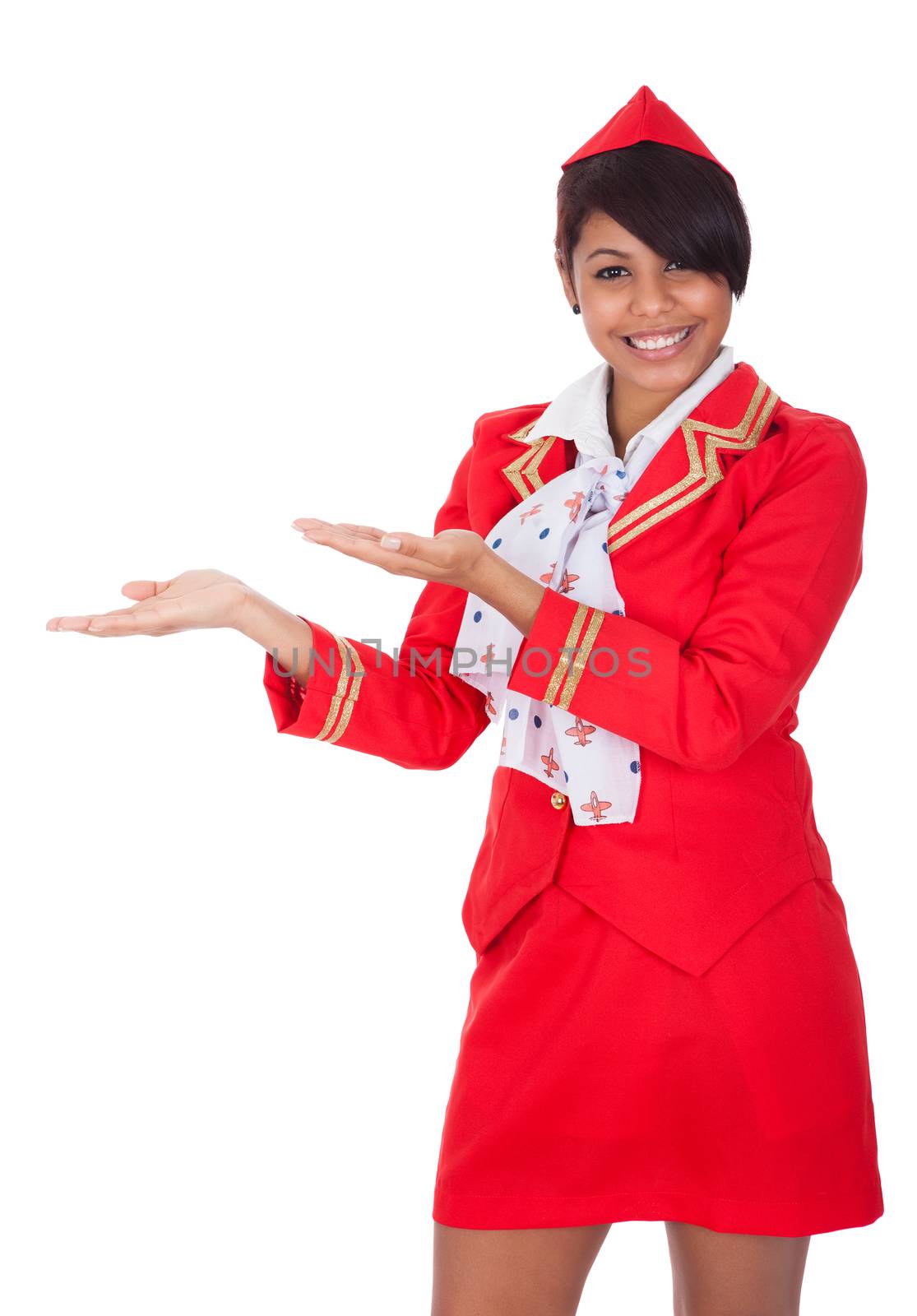 Portrait of young beautiful stewardess. Isolated on white