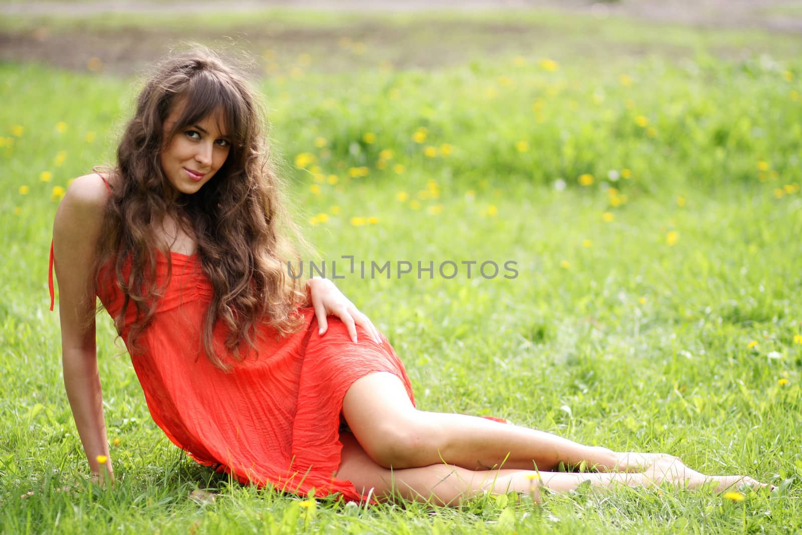 Portrait in full growth, attractive young woman in red dress