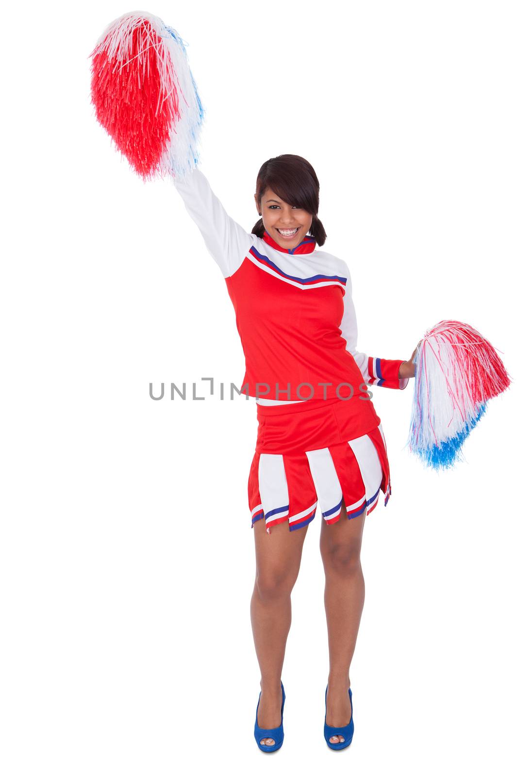 Smiling beautiful cheerleader with pompoms. Isolated on white