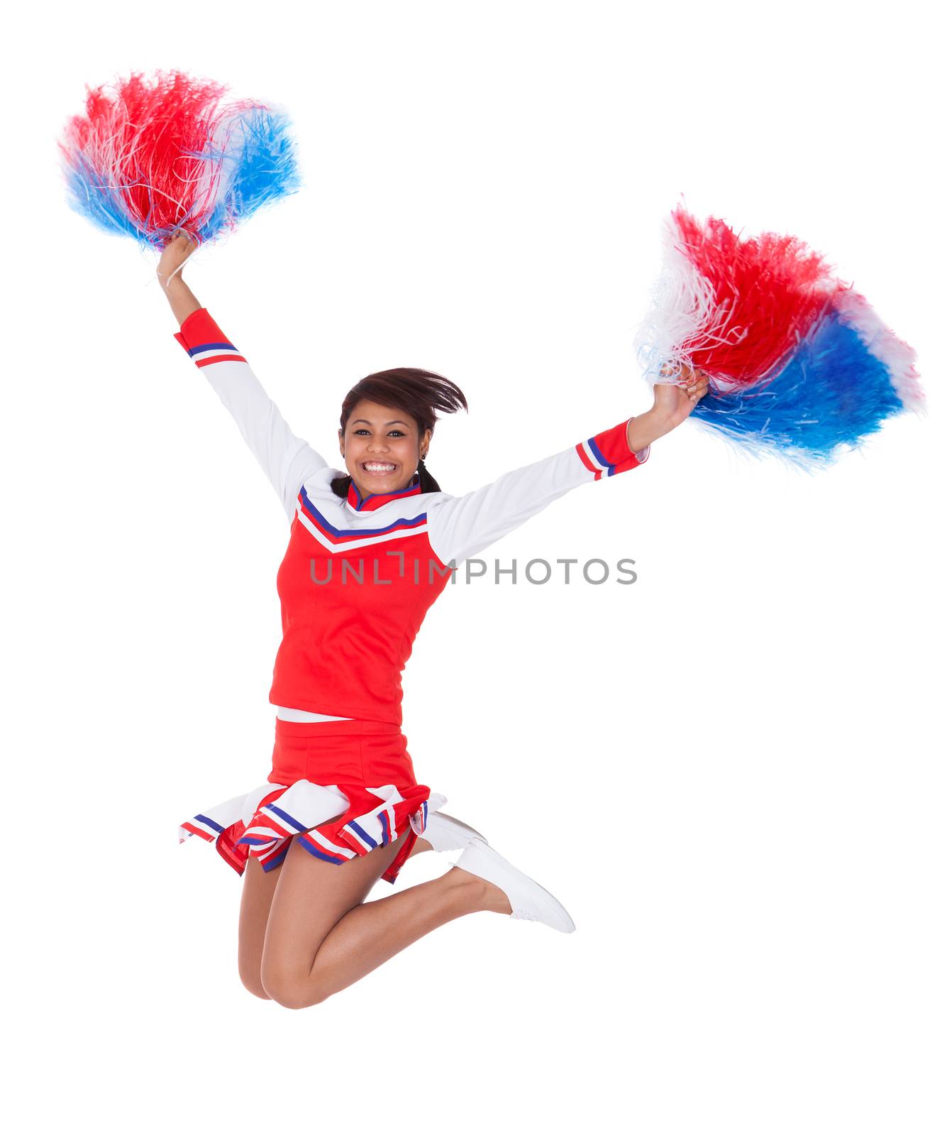 Smiling beautiful cheerleader with pompoms. Isolated on white