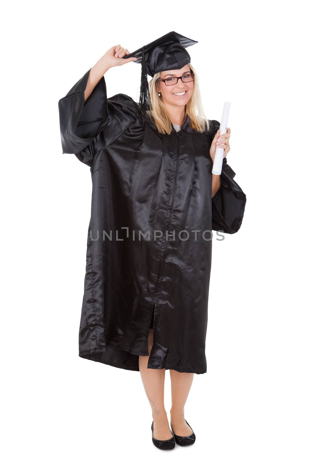 Beautiful female student graduating. Isolated on white