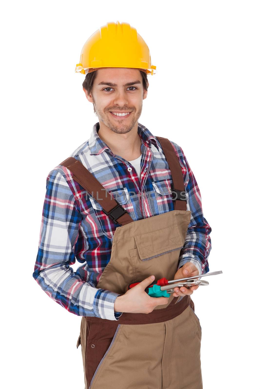 Confident worker wearing hard hat. Isolated on white