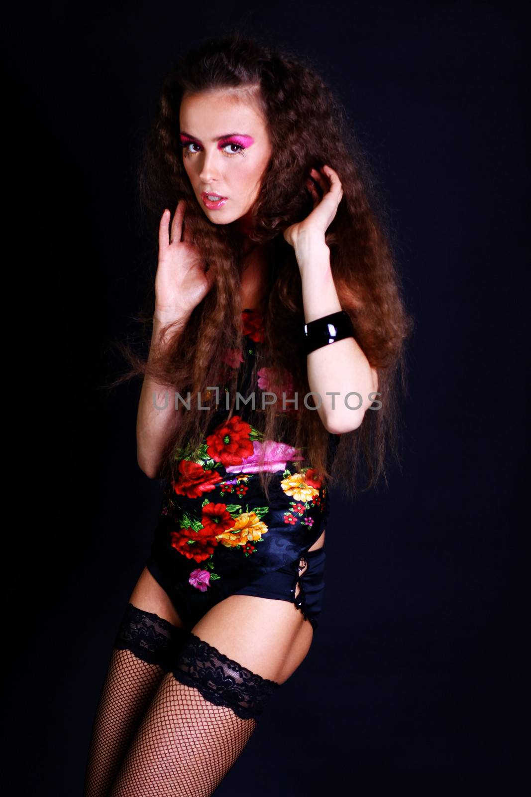 Beautiful young woman in gray background