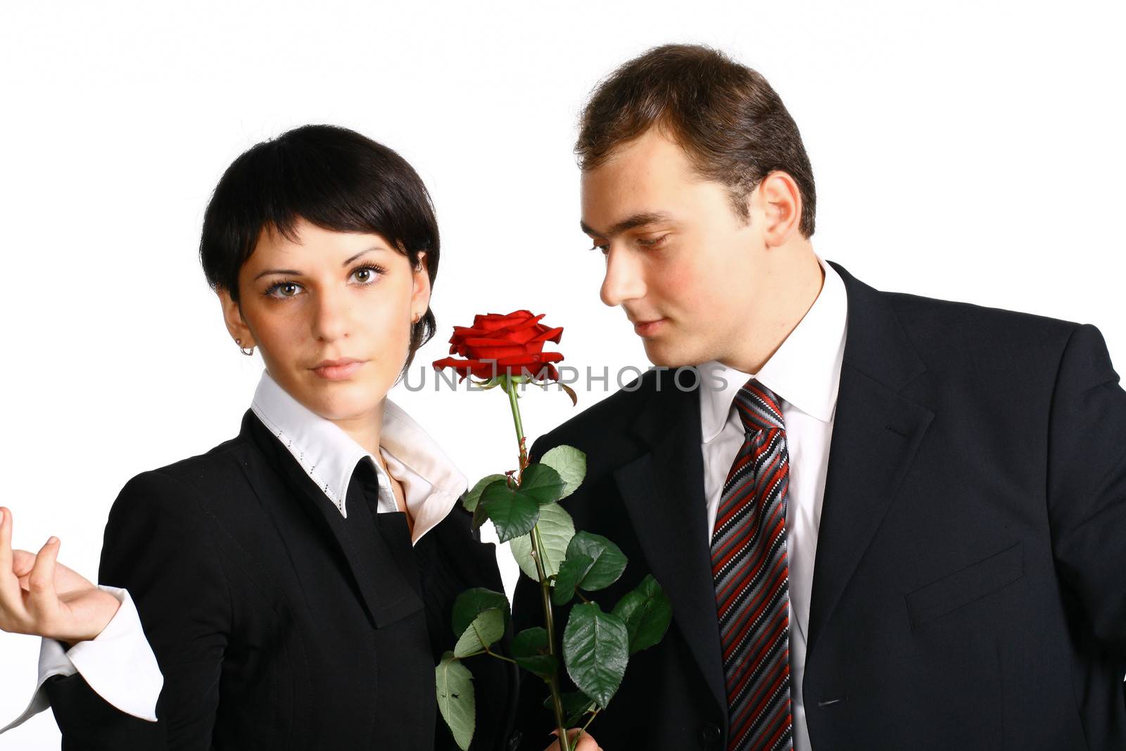 The business girl works and director tries to present it a flower