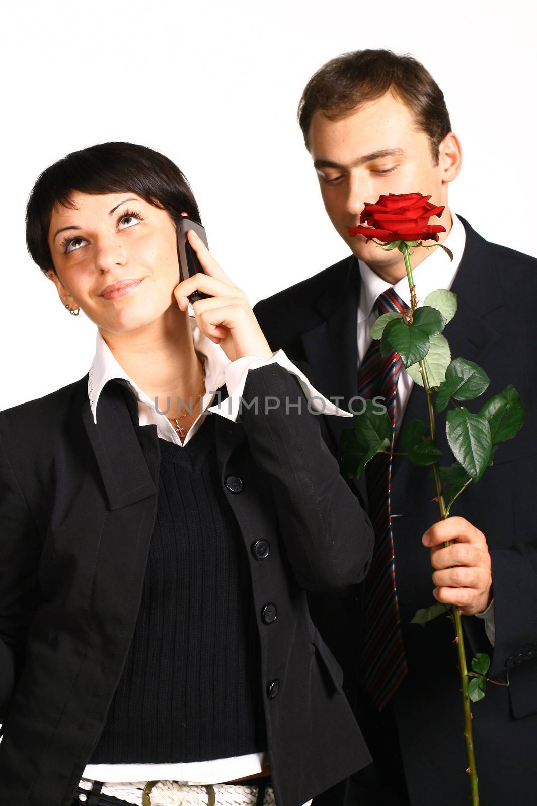 The business girl works and director tries to present it a flower