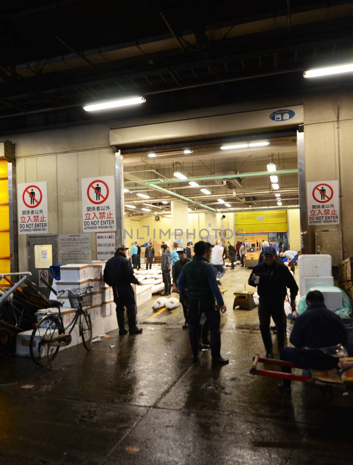 TOKYO - NOV 26: Shoppers visit Tsukiji Fish Market by siraanamwong