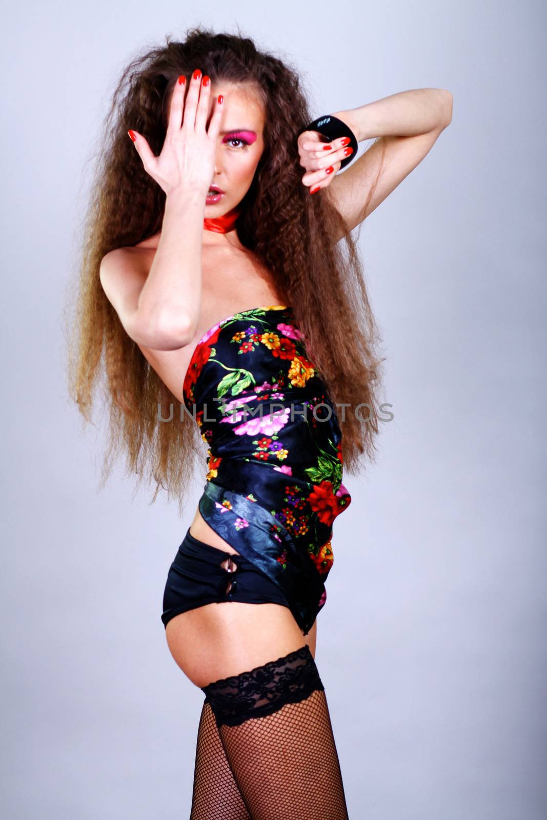 Beautiful young woman in gray background