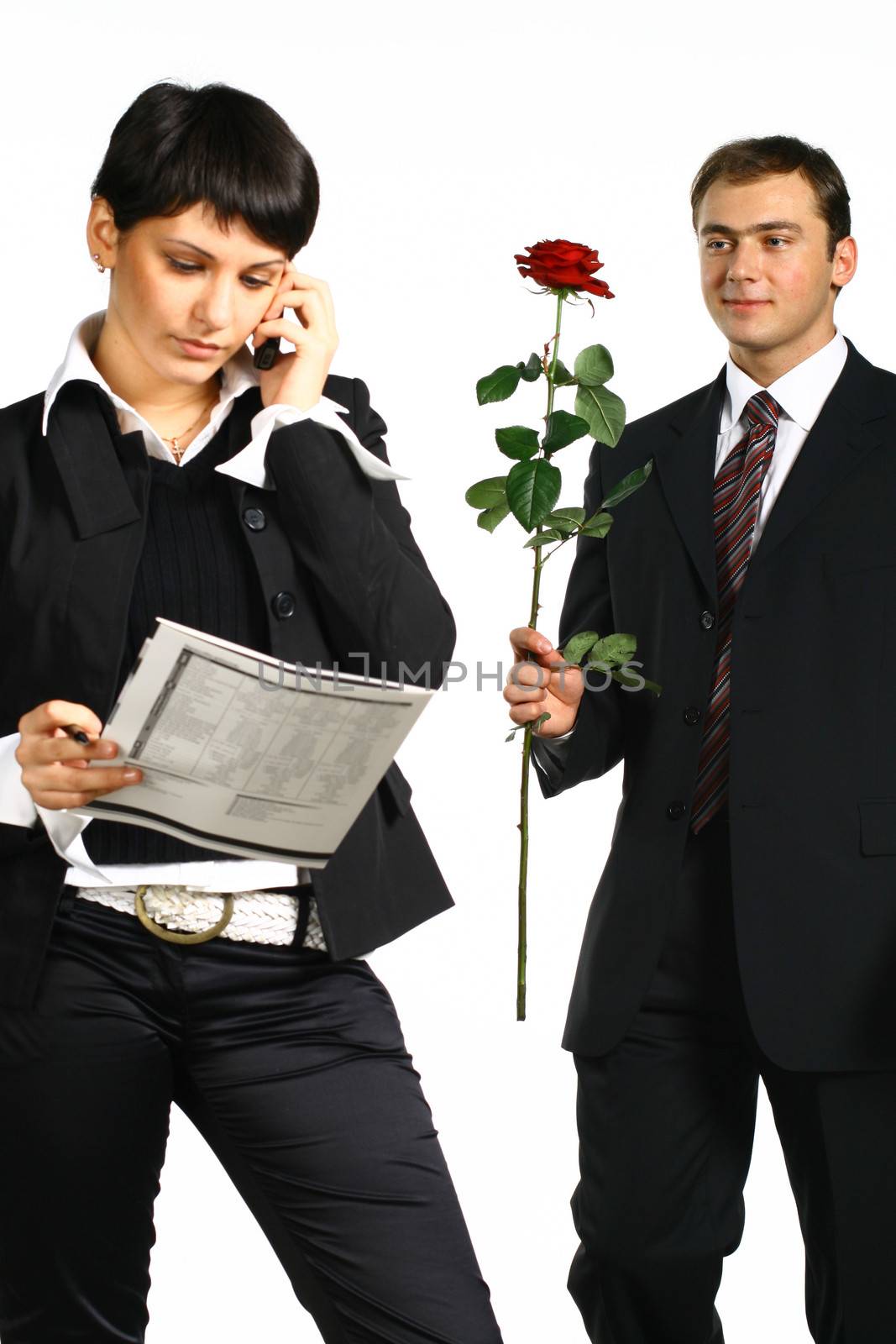 The business girl works and director tries to present it a flower