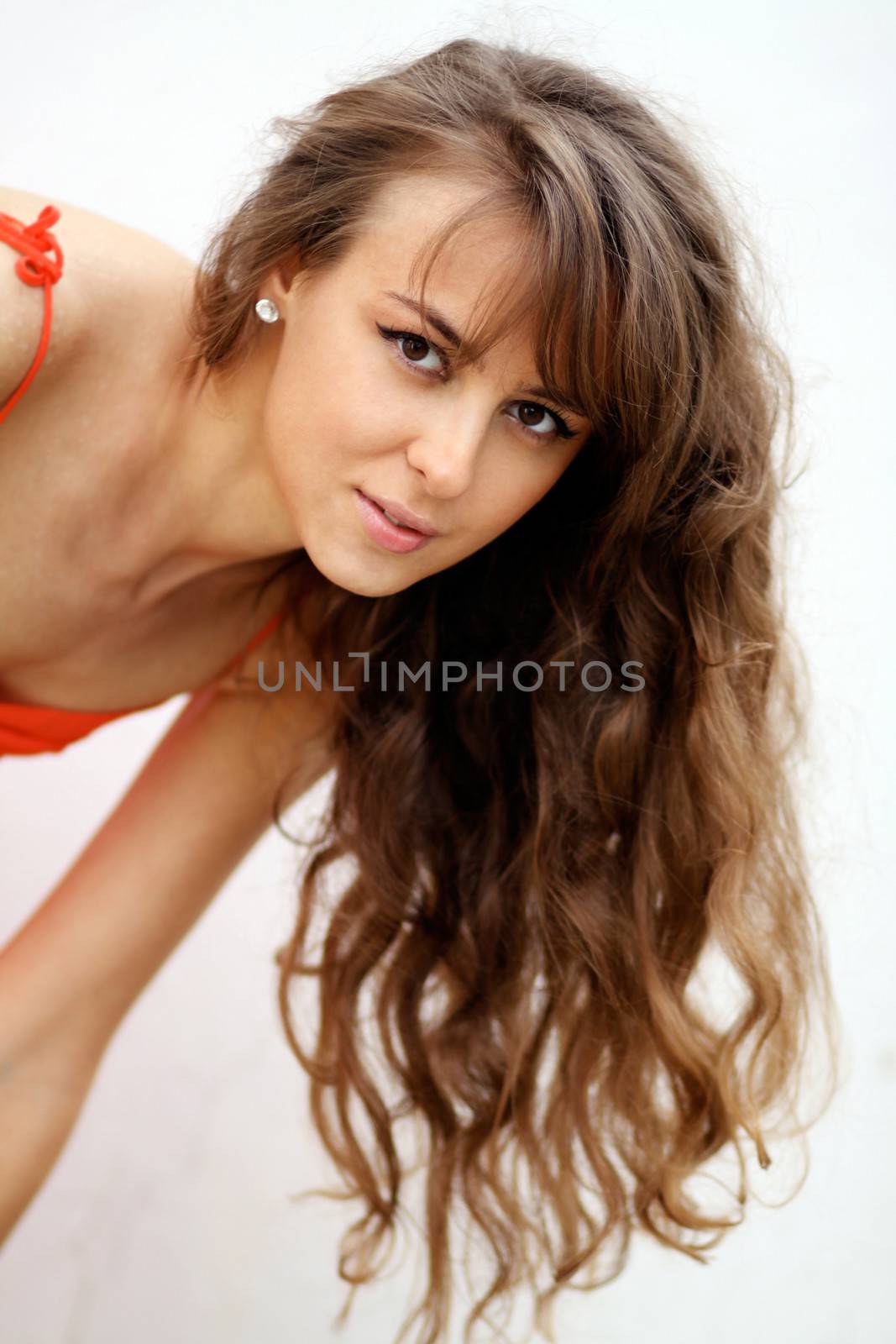 Beautiful young woman in gray background