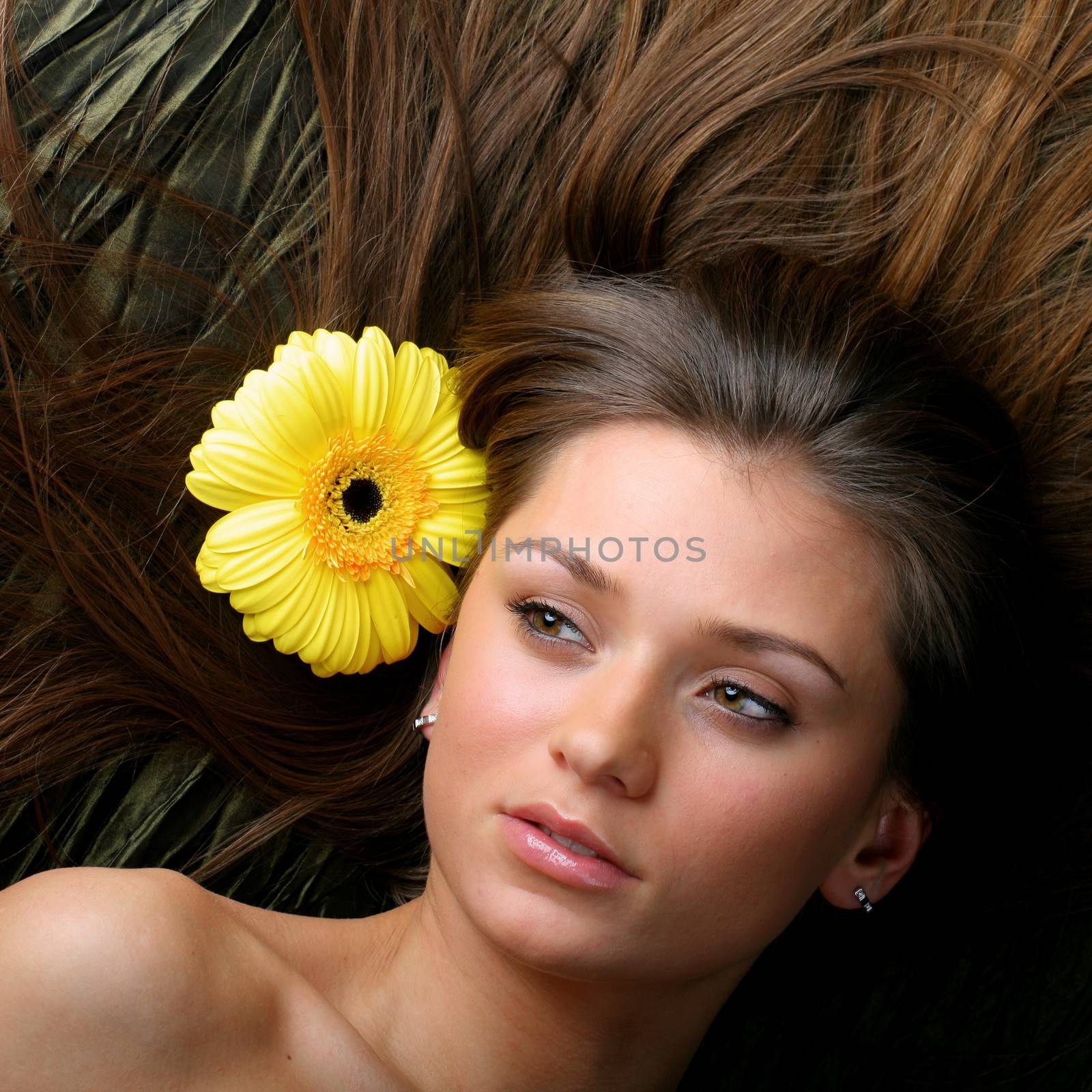 beautiful yellow flowers in girl hair